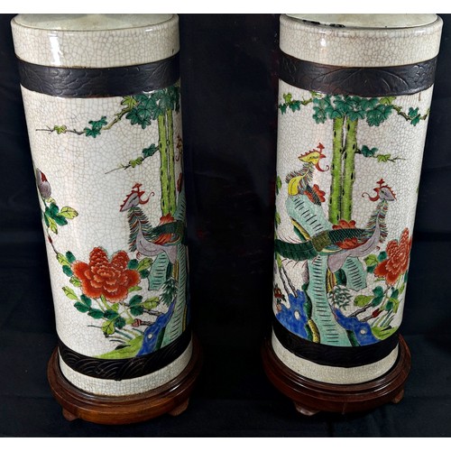 80 - A pair of Japanese crackle glaze cylinder vases, decorated with exotic birds in floral settings, lat... 