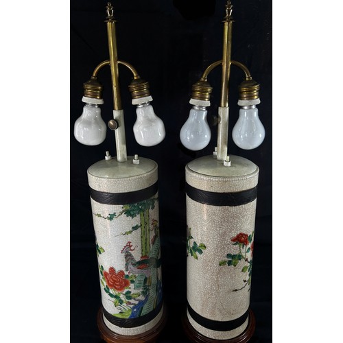 80 - A pair of Japanese crackle glaze cylinder vases, decorated with exotic birds in floral settings, lat... 