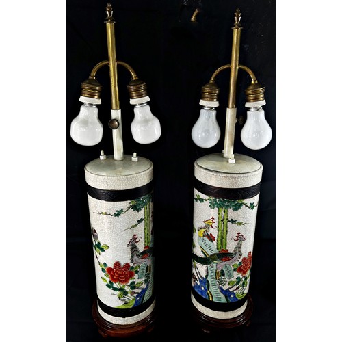 80 - A pair of Japanese crackle glaze cylinder vases, decorated with exotic birds in floral settings, lat... 