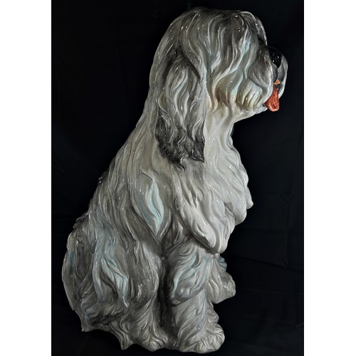 83 - A very large Italian ceramic model of a seated Old English Sheepdog, marked ‘made in Italy’ to under... 