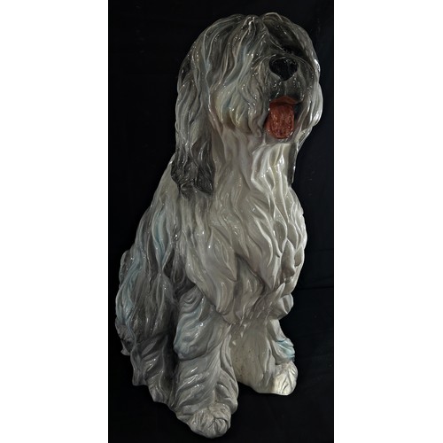 83 - A very large Italian ceramic model of a seated Old English Sheepdog, marked ‘made in Italy’ to under... 