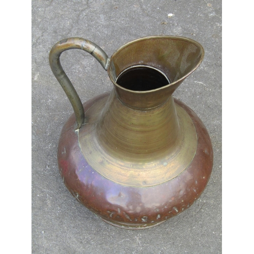 1046 - A 19th century Rococo fire curb/fender 127 cm together with a copper and brass jug with loop handle ... 