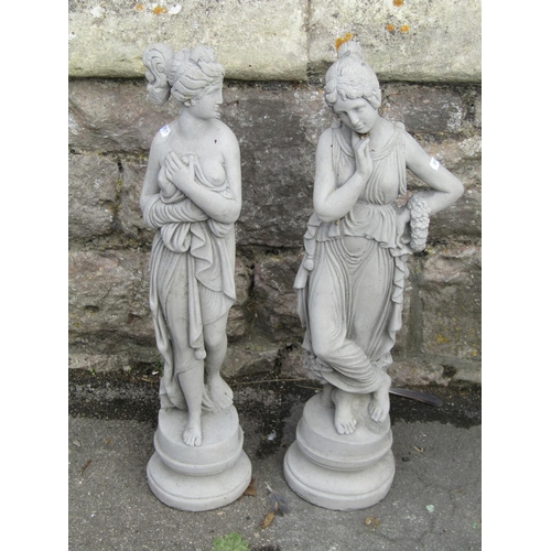 1050 - Two small cast composition stone garden/interior ornaments in the form of  standing classical maiden... 