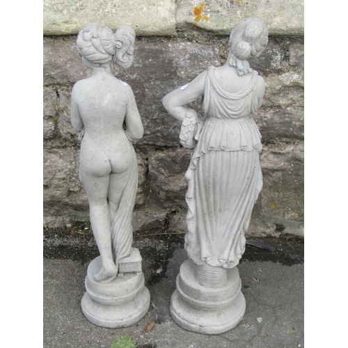 1050 - Two small cast composition stone garden/interior ornaments in the form of  standing classical maiden... 