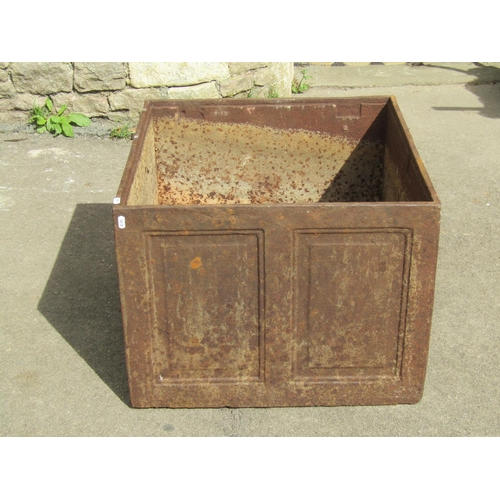 1053 - A weathered 19th century cast iron strong box with panelled frame (lacks lid), 47 cm high x 61 cm sq... 