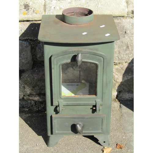 1066 - A small Villager cast iron multi fuel stove with arched glazed panelled drop door, 59cm high x 34cm ... 