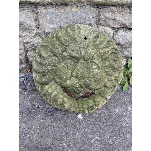 1070 - A weathered cast composition stone wall mask depicting the element 'wind' 36cm diameter