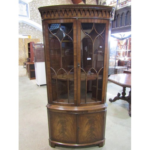 1085 - A good quality reproduction floor standing bow fronted corner display cabinet enclosed by four doors... 