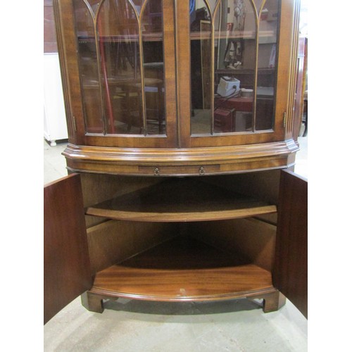 1085 - A good quality reproduction floor standing bow fronted corner display cabinet enclosed by four doors... 