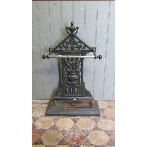 1061 - A Victorian cast iron umbrella/stick stand with decorative pierced and scrolling foliate, urn and ot... 