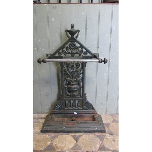 1061 - A Victorian cast iron umbrella/stick stand with decorative pierced and scrolling foliate, urn and ot... 