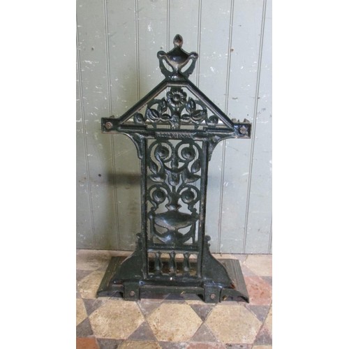 1061 - A Victorian cast iron umbrella/stick stand with decorative pierced and scrolling foliate, urn and ot... 