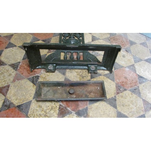 1061 - A Victorian cast iron umbrella/stick stand with decorative pierced and scrolling foliate, urn and ot... 