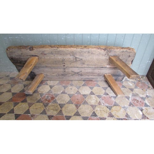 1057 - An antique pine pig bench with through jointed splayed legs, 36cm high x 138cm long x 56cm wide