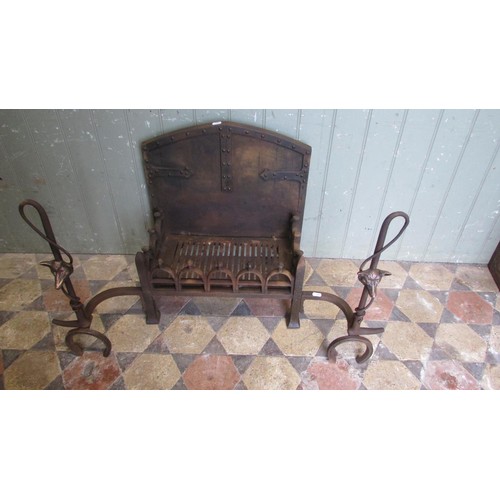 1045 - An unusual cast iron fire basket with pierced stirrup grate beneath an arched old English style back... 