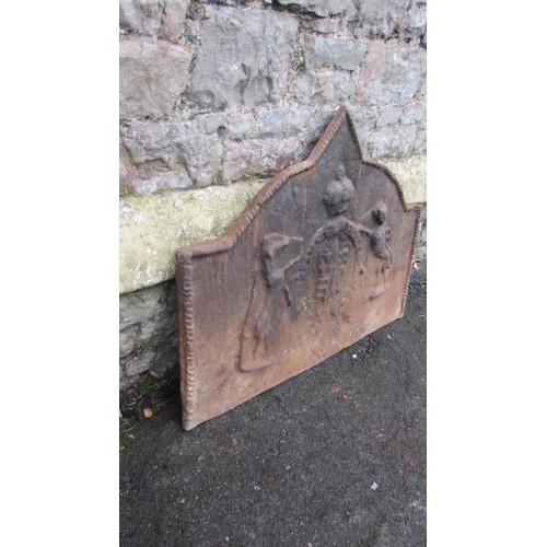 1081 - An old cast iron fire back of rectangular stepped rounded and pointed arched form, with rope twist b... 