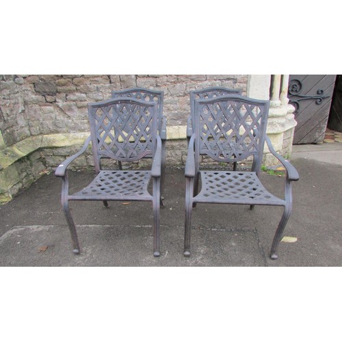 1008 - A set of four contemporary lattice back garden elbow chairs (capable of stacking)