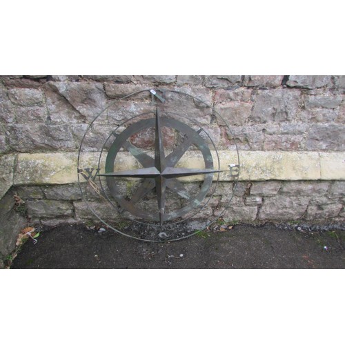 1062 - A contemporary copper verdigris radiating star compass, 80cm diameter