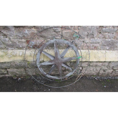 1062 - A contemporary copper verdigris radiating star compass, 80cm diameter