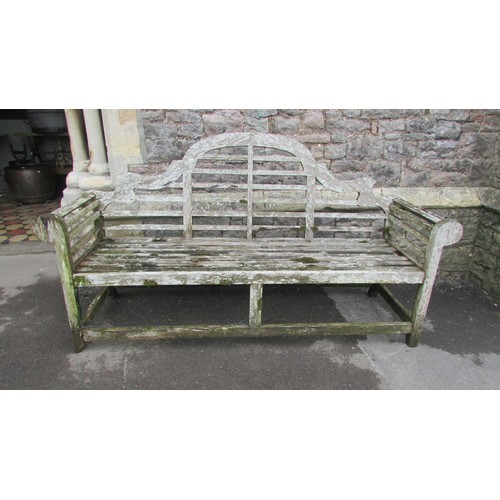 1017 - A weathered teak Lutyens bench 197cm (af)