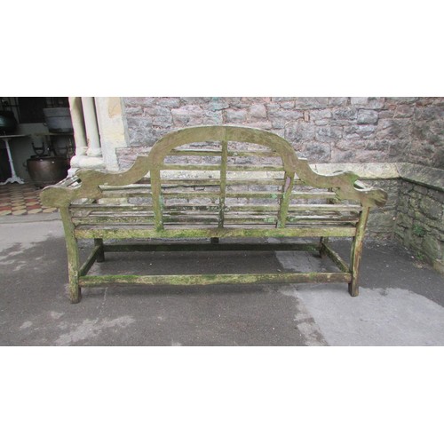 1017 - A weathered teak Lutyens bench 197cm (af)