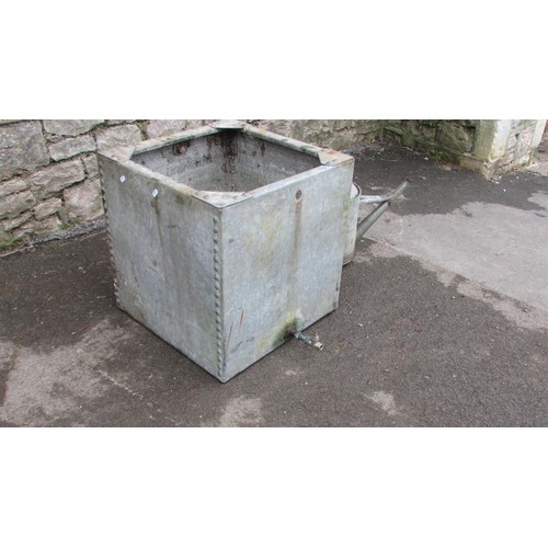 1015 - A square galvanised steel water tank with pop rivetted seems, 52cm square, together with a watering ... 