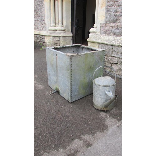 1015 - A square galvanised steel water tank with pop rivetted seems, 52cm square, together with a watering ... 