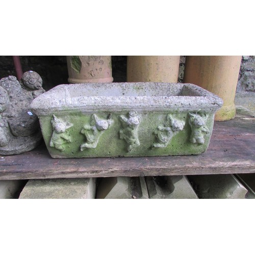 1021 - A weathered rectangular cast stone trough with repeating cherub detail, together with three buff col... 