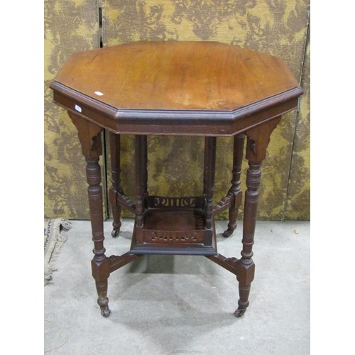 1123 - An Edwardian walnut occasional table of octagonal form together with an Edwardian walnut bedside cup... 