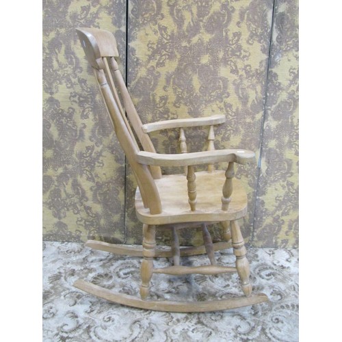 1139 - A modern beechwood Windsor rocking chair with pierced fiddle shaped splat