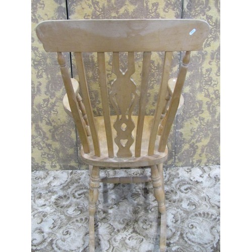 1139 - A modern beechwood Windsor rocking chair with pierced fiddle shaped splat