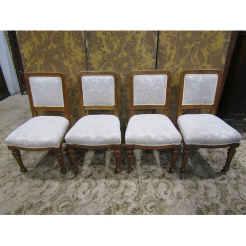 1140 - A set of 4 Victorian oak dining chairs with cream ground scrolling acanthus patterned upholstered se... 