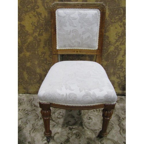 1140 - A set of 4 Victorian oak dining chairs with cream ground scrolling acanthus patterned upholstered se... 