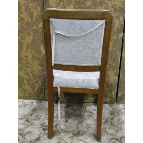 1140 - A set of 4 Victorian oak dining chairs with cream ground scrolling acanthus patterned upholstered se... 