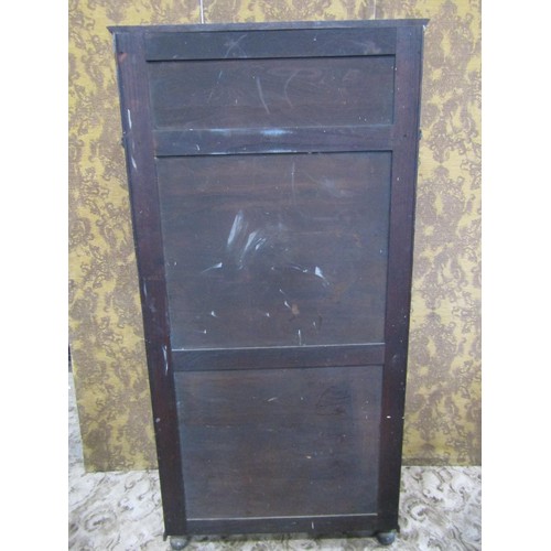 1143 - A reproduction old English style oak freestanding side cupboard partially enclosed by a pair of thre... 