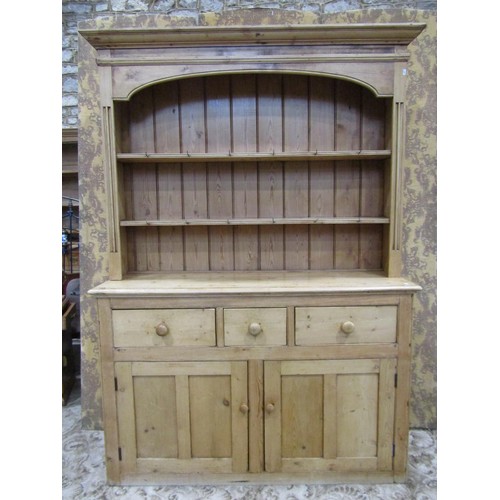 1147 - A stripped pine farmhouse kitchen dresser the base enclosed by a pair of panelled doors and three fr... 