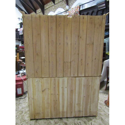 1147 - A stripped pine farmhouse kitchen dresser the base enclosed by a pair of panelled doors and three fr... 