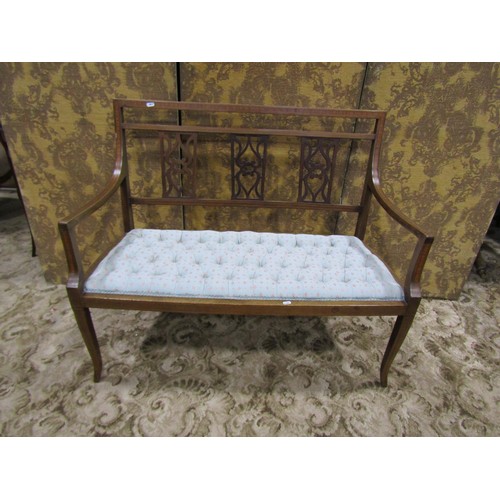 1154 - An inlaid Edwardian mahogany parlour sofa with pierced splats and buttoned upholstered seat, 110cm w... 