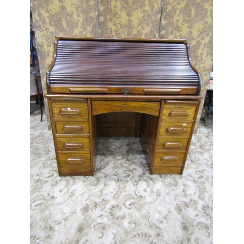 1158 - A oak roll kneehole twin pedestal desk, with S shaped tambour roll, 118cm high x 122cm wide x 79cm d... 