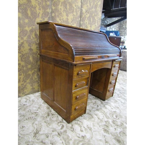 1158 - A oak roll kneehole twin pedestal desk, with S shaped tambour roll, 118cm high x 122cm wide x 79cm d... 