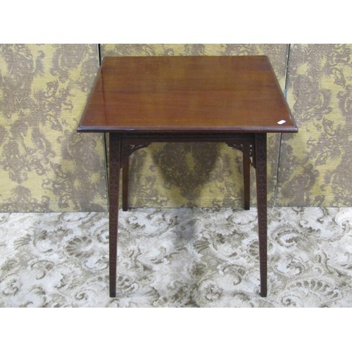 1166 - An Edwardian mahogany occasional table raised on square tapered supports with blind fret detail, 67c... 