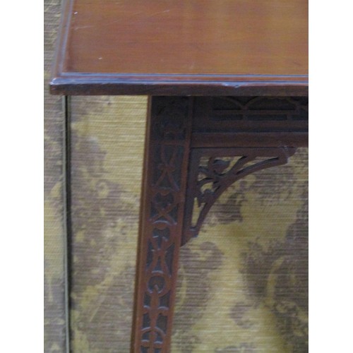 1166 - An Edwardian mahogany occasional table raised on square tapered supports with blind fret detail, 67c... 