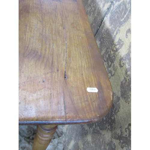 1168 - A pine rectangular kitchen table with central frieze drawer raised on turned supports, 74cm high x 1... 