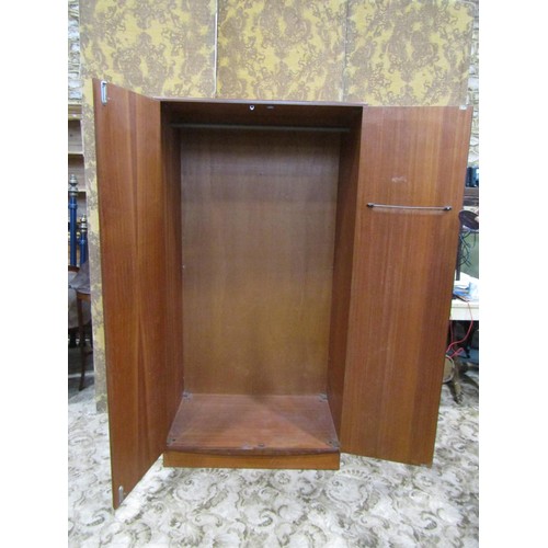 1169 - A G Plan teak bedroom pair comprising a two door wardrobe and a kneehole dressing table with floatin... 