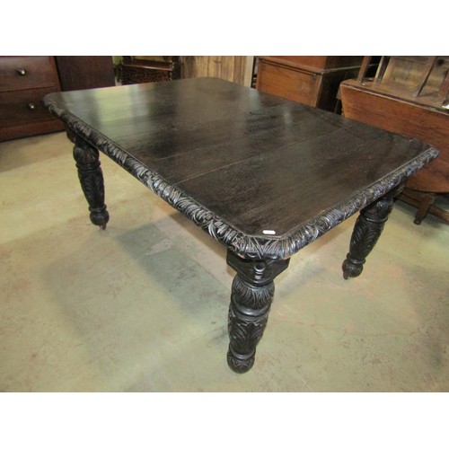 1172 - A Victorian carved oak wind-out extending dining table with single additional leaf raised on turned ... 