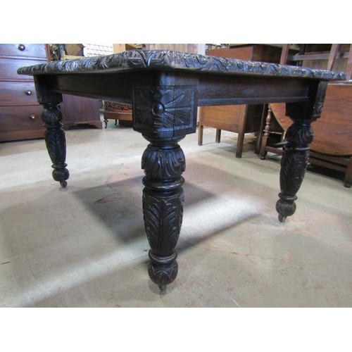 1172 - A Victorian carved oak wind-out extending dining table with single additional leaf raised on turned ... 