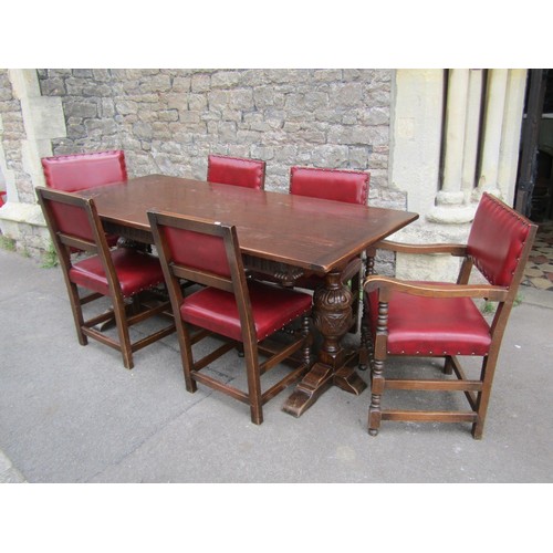 1173 - A reproduction Old English style oak refectory table by Bevan Funnell, raised on cup and cover balus... 