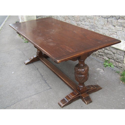 1173 - A reproduction Old English style oak refectory table by Bevan Funnell, raised on cup and cover balus... 