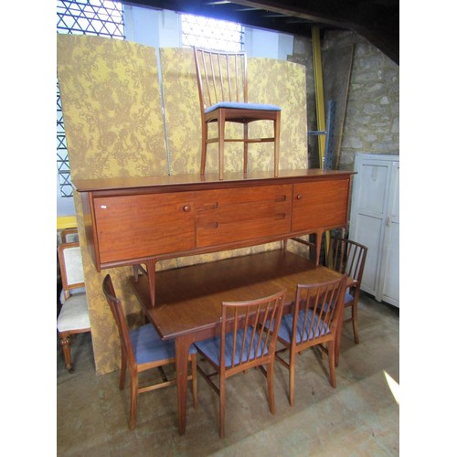 1153 - An A Younger Ltd mid-20th century teak dining room suite comprising a long sideboard, 75cm high x 21... 