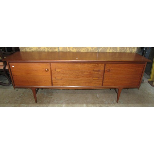 1153 - An A Younger Ltd mid-20th century teak dining room suite comprising a long sideboard, 75cm high x 21... 